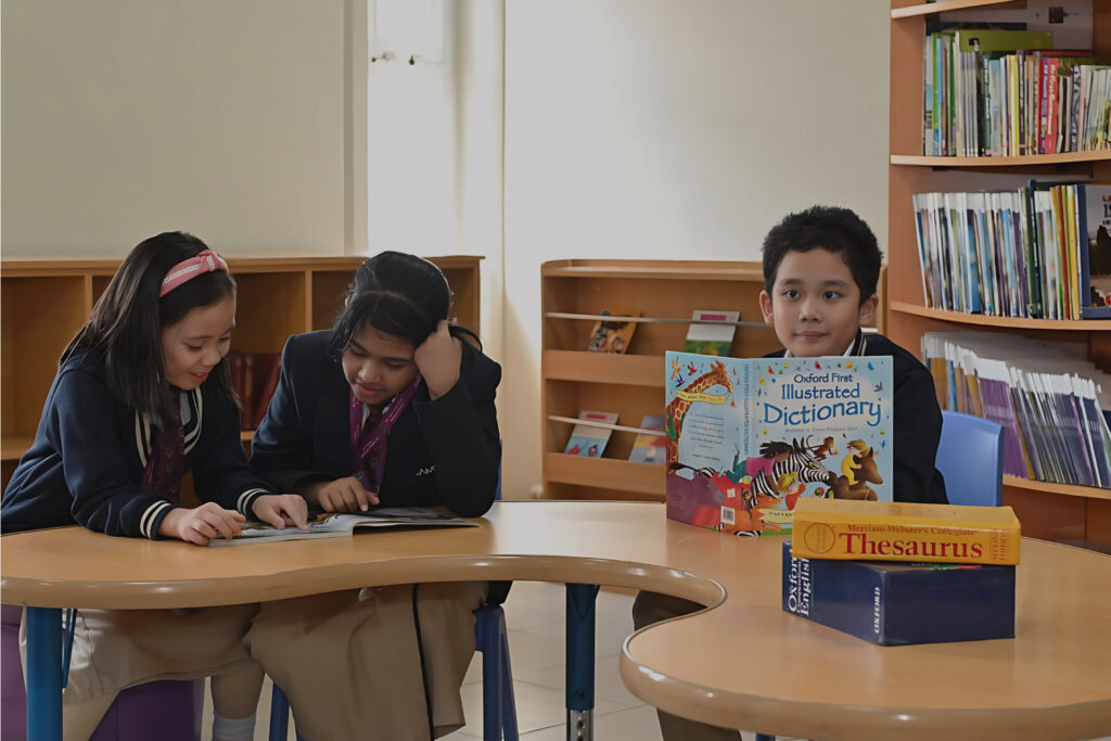 Students participating in classroom activities at Apple International Community School, a British curriculum school in Al Karama, Dubai.